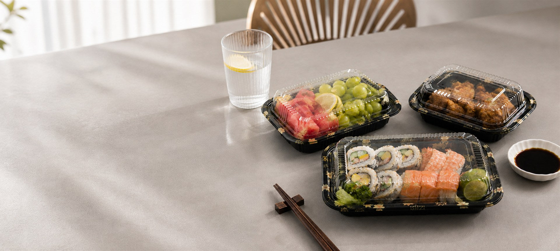 Black PET sushi tray with clear lid for deli and cold food display